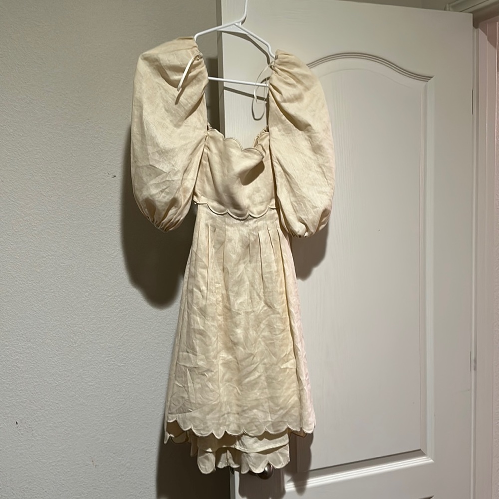 Cream puffy shoulder mini dress with tie in back